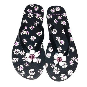 Tory Burch black stamped floral flip flops
